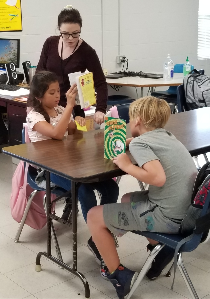 Mrs. Spears helping students.